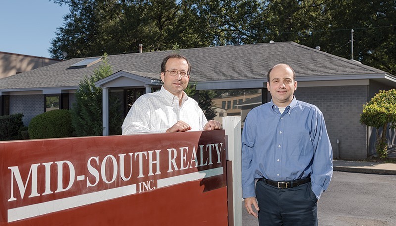 George Couloubaritsis and Jerry Couloubaritsis in front of Mid-South Realty, Inc.